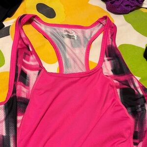 Vibrant Pink Women's Fila athletic top, long, loose fit.